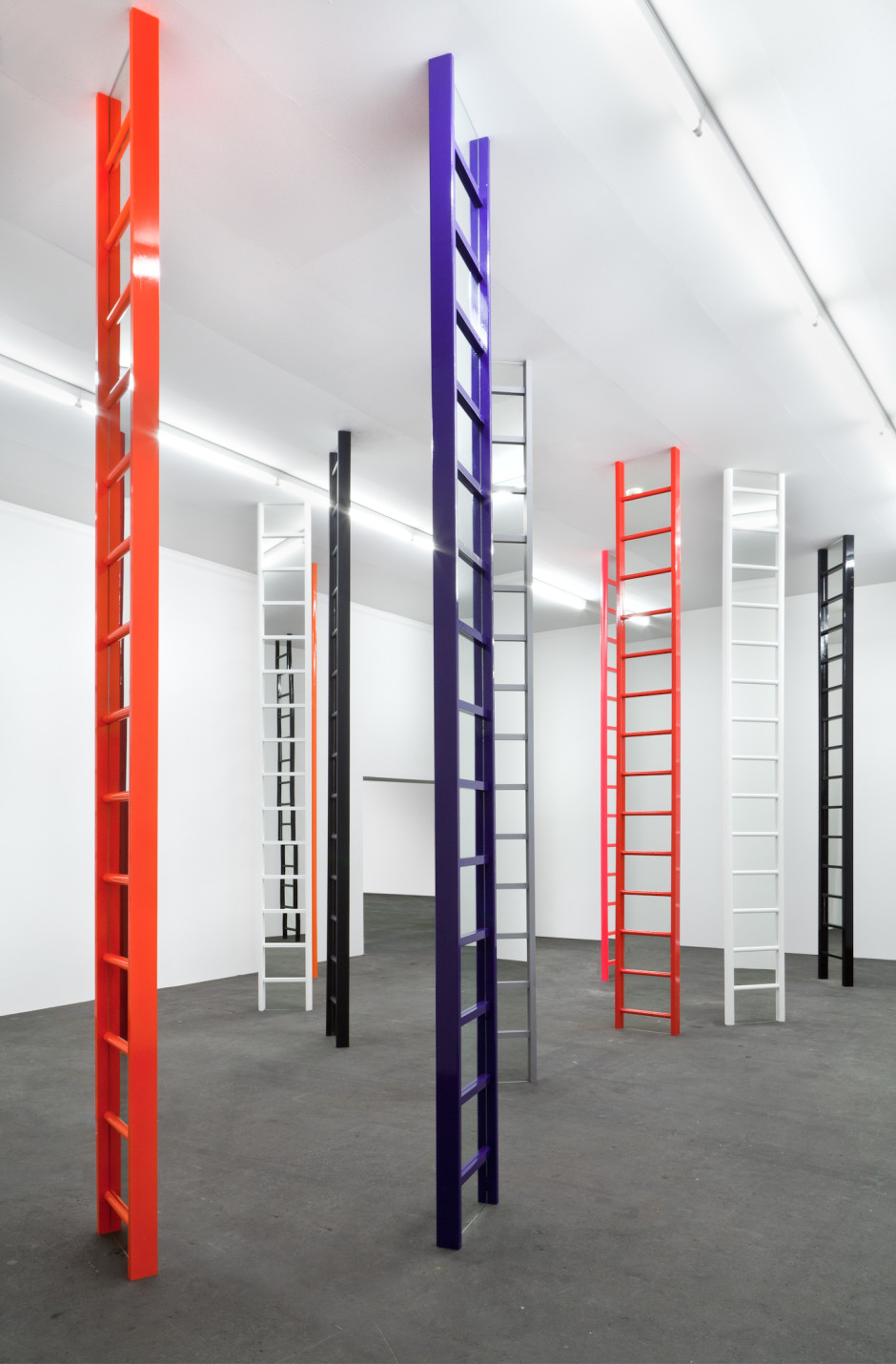 Shaved Ice (Glasgow), 2012-2014  eighteen wooden ladders, mirrors, household matt, gloss and fluorescent paint  height, each: 392 cm / 154 ⅜ in