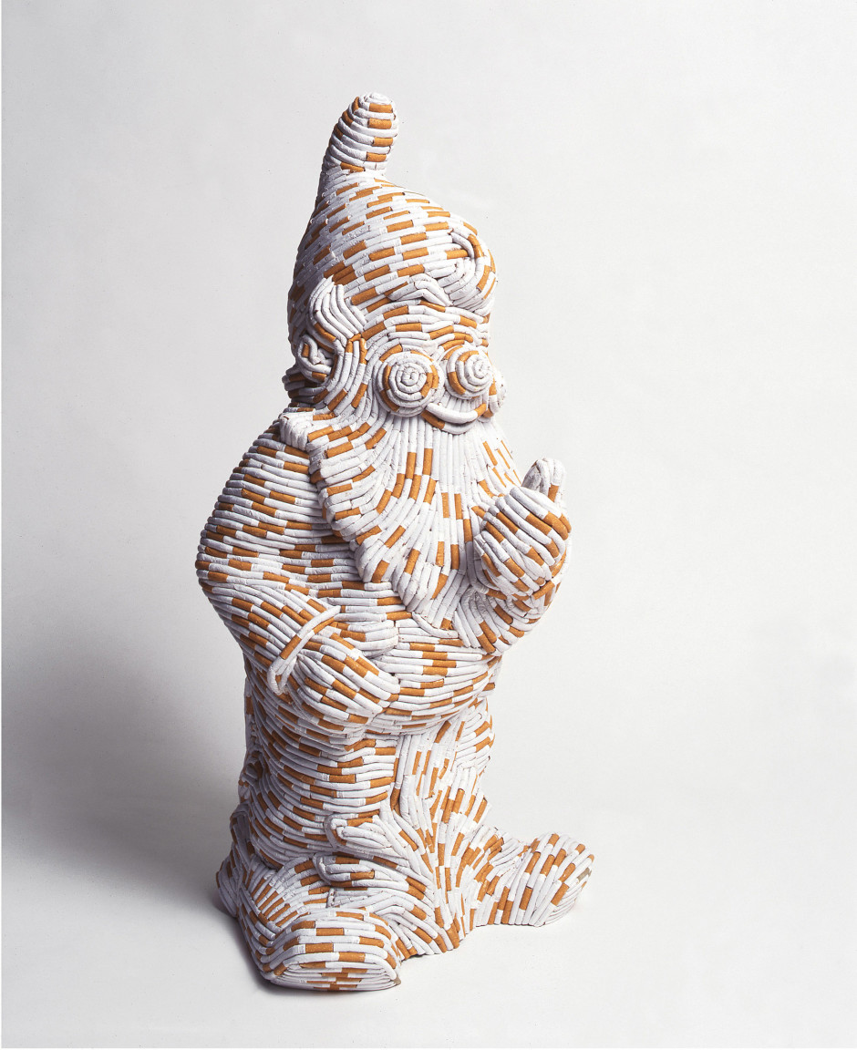 Willy, 2000  cast plastic garden gnome, cigarettes  86.0 x 42.0 x 34.0 cm 33 7/8 x 16 1/2 x 13 3/8 in.
