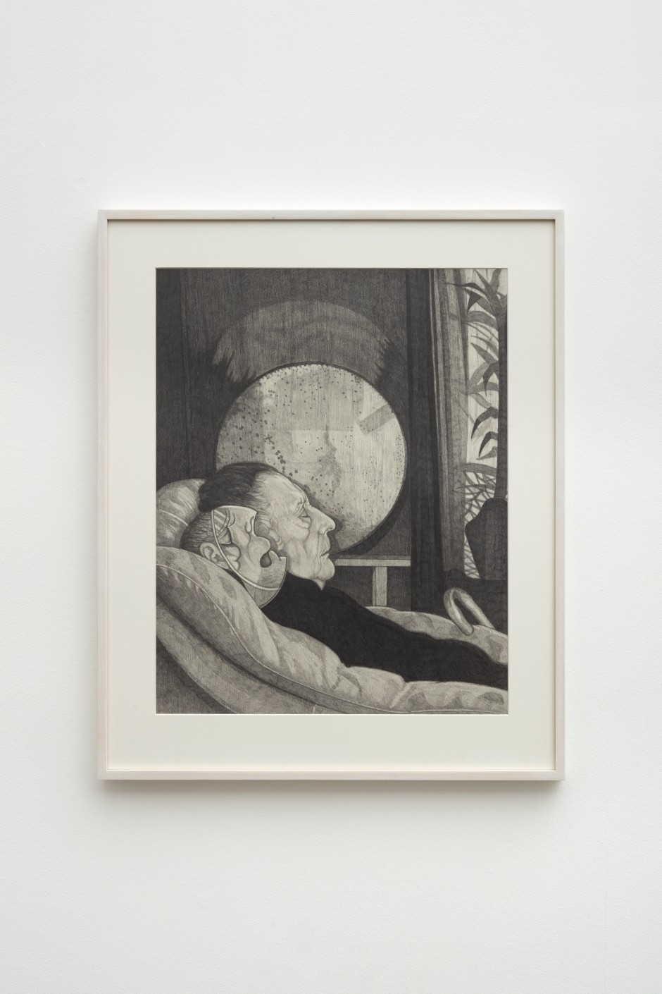 Paul Anthony Harford  Untitled (Mother asleep with masked child), ca. 1999  graphite on paper  site size: 61 x 49 cm / 24 ⅛ x 19 ¼ in frame size: 76.5 x 63.5 x 3.8 cm / 30 ⅛ x 25 x 1 ½ in  Paul Anthony Harford (1943-2016) trained at Byam Shaw School of Art in London as a mature student in the late 1960s, before moving to Southend – a sea-side town on England’s Southeast coast. Harford lived at different times in Southend and Weymouth, and worked variously as a schoolmaster, cleaner, bin man and hospital porter. Over the course of his life, he completed hundreds of drawings – virtually all of them in pencil and graphite stick – which he kept stacked around the walls of his attic studio. Only a small fraction of these survive. Within and between drawings, Harford moved between social realism – capturing and caricaturing fragments of reality – and wry, wayward surrealism.  Characterised by a minutely detailed style and subtle tonal range, Harford’s drawings frequently evoke the life and atmosphere of the seaside towns in which he lived: promenades, pubs and pavilions serve as the backdrops to scenes of becalmed existence. Often, an air of desolation or ennui prevails.  Harford’s drawings of his mother show her seated and contemplative, or frail and asleep during her final days, as we see in this drawing Untitled (Mother asleep with masked child), ca. 1999. His forensic attention to surface detail – seen in the play of light across her sleeping face – poignantly amplifies the sense of mortality in these images.