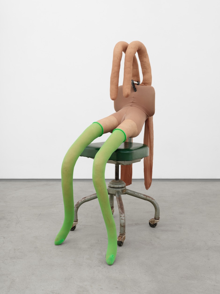 Sarah Lucas  Bunny Gets Snookered #13, 2019  tights, plastic, wood, chrome chair, clamp, kapok and wire  117 x 50 x 80 cm / 46 ⅛ x 19 ¾ x 31 ½ in  Sarah Lucas’s Bunny Gets Snookered #13, 2019, is a recent incarnation of Lucas’s now iconic Bunny sculptures. First conceived in 1997, Lucas’s Bunny sculptures evoke female nudes reclining on chairs in states of abandon and vulnerability. Employing the same everyday materials as in the beginning, the soft sculptures animate feminine biomorphic forms made from stuffed tights, fluff, clamped to found seating. The slumped stance and splayed legs amount to ambiguous expressions of either sexual availability of vulnerability, echoing the ambivalent connotations of Hans Bellmer’s dolls and mannequins. The use of everyday ‘readymade’ materials is characteristic of Lucas’s work. The chairs function therefore as stand-ins for the human body, just as furniture is used elsewhere in Lucas’s work as a metaphor for the body and revealing the (often sexist) clichés that are employed to depict and discuss it. For the exhibition Bunny Gets Snookered in 1997, Lucas installed a group of Bunny sculptures on top of and around a snooker table, conjuring associations with the archetypally ‘male’ world of the snooker hall.