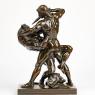 a brown bronze sculpture depicting a struggle between a man and a monotaur