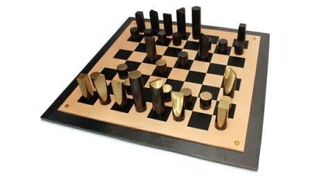 <p><strong>Simon Hasan</strong>, Slice Chess Set, 2012</p><p>Patinated brass, screen printed leather, hot rolled steel plate, brass fittings</p><p>60 W x 60 D x 2 H cms</p><p>Edition of 3 plus 1 Artist's Proof</p>