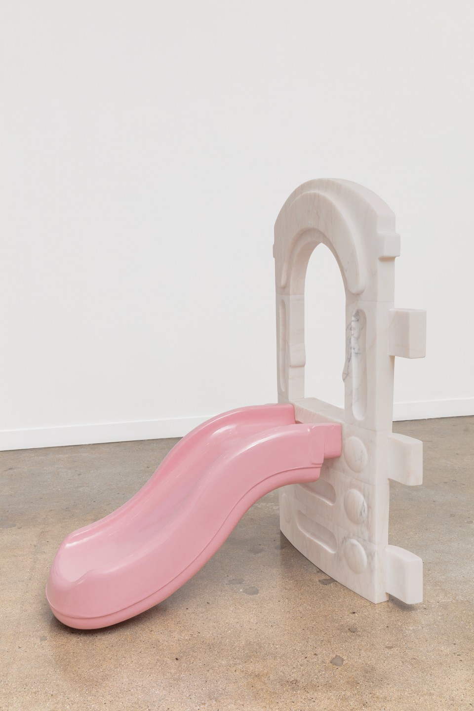 Artwork: Nevine Mahmoud  Child's play (frame), 2021  Portugese pink marble, plastic and autobody paint  54 x 30 x 44 inches (137.2 x 76.2 x 111.8 cm)