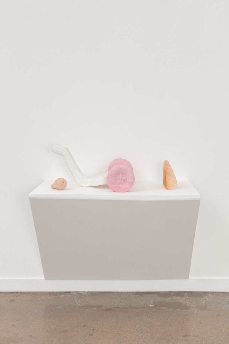 Image: Nevine Mahmoud  Tricycle index (soft parts in 3 components), 2021  plaster, pigment and pink alabaster  13 1/2 x 38 x 22 inches (34.3 x 96.5 x 55.9 cm)