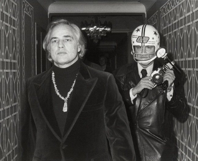 Ron Galella, Marlon Brando and Ron Galella photographed by Paul Schmulbach at the Waldorf-Astoria Hotel, New York, November 26, 1974, 1974